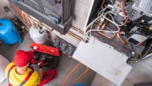 Residential Heating Systems Technician Performing Maintenance