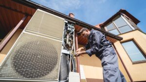 HVAC technician servicing home heating and cooling system(opens in a new tab or window)